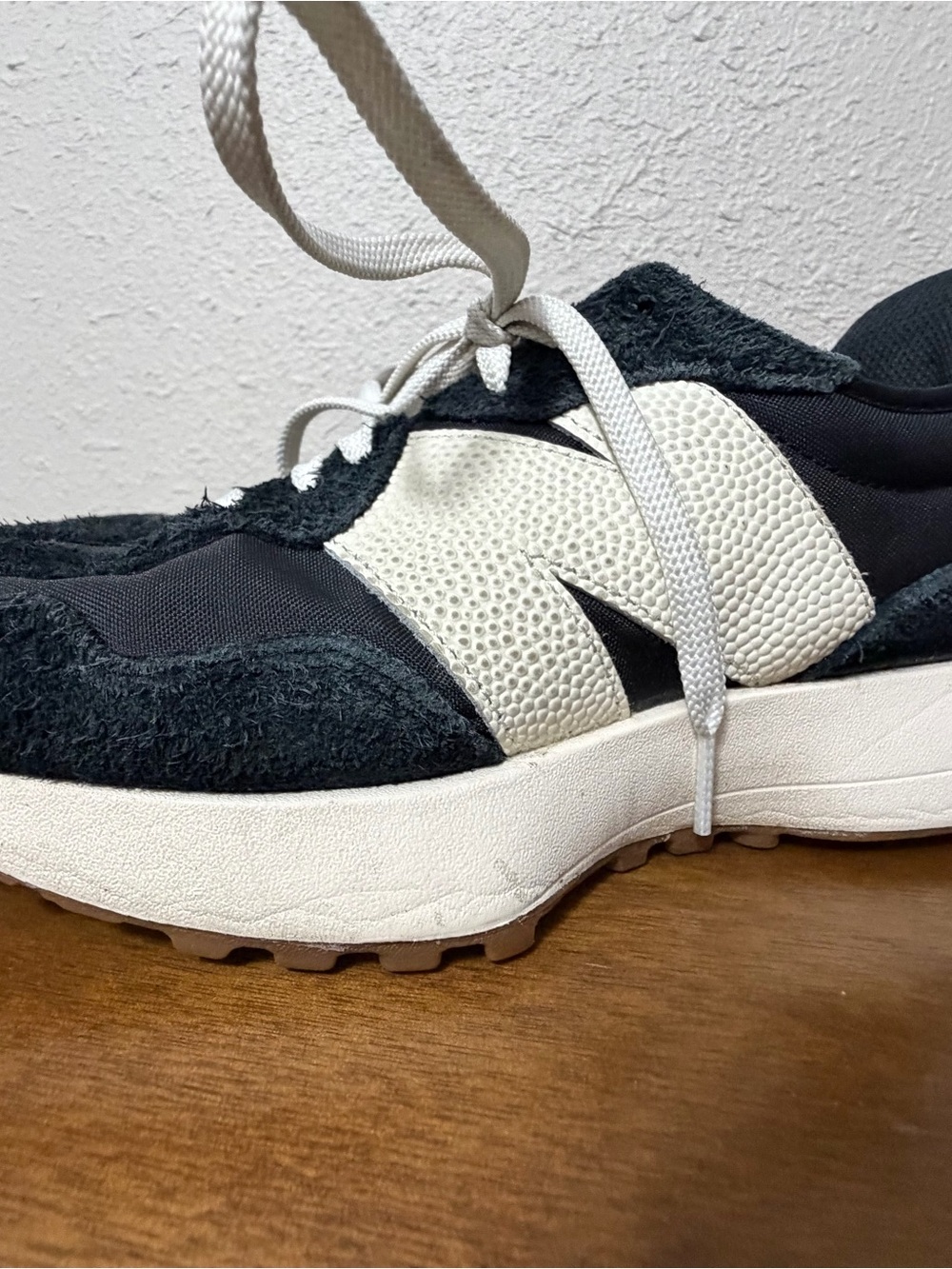 New Balance Womens Black and White Sneaker with Suede Accents